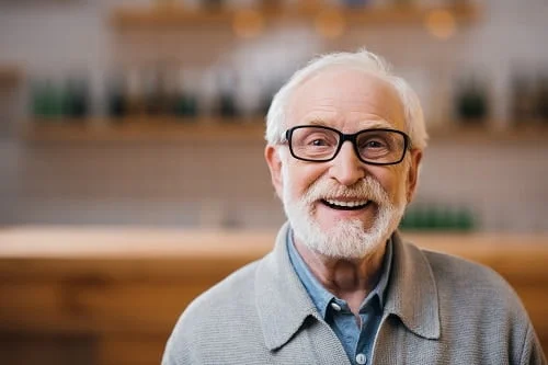 brochure 9 older man with white hair and glasses resized