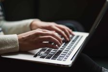 person typing on a computer