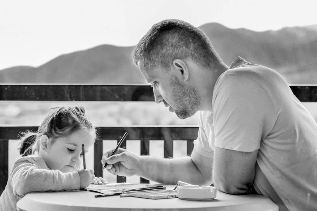 Father and daughter working together on his memoir