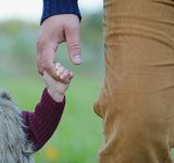 father daughter walk hand in hand