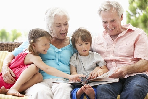 family reading grandparents and kids resized